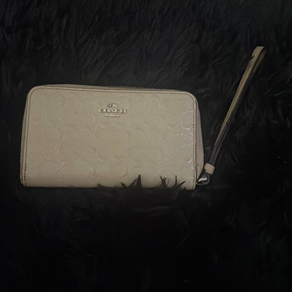 Tan coach wristlet